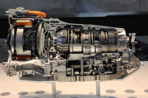 Cutaway view of a car transmission showing gears and internal components