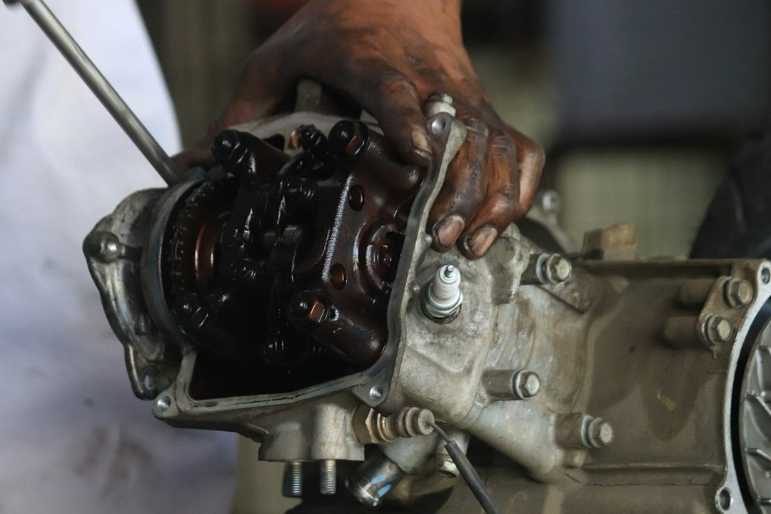 Open transmission housing showing exposed oil-coated internal components
